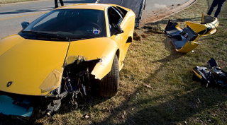 Illustration for article titled Yokels Molest Crashed Lamborghini